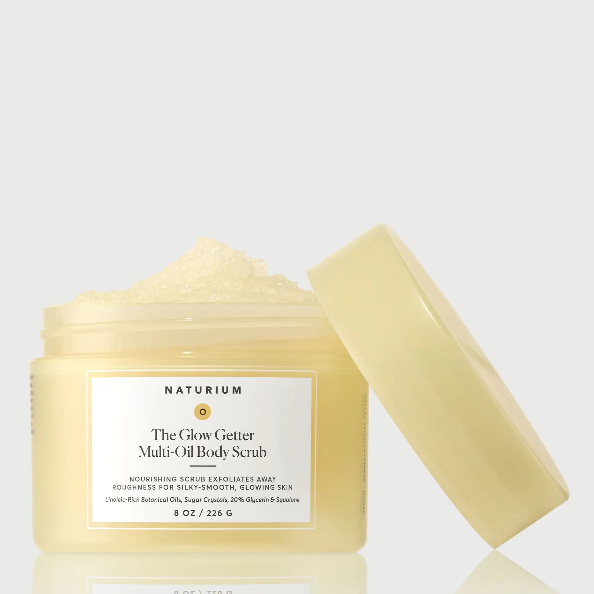 the-glow-getter-multi-oil-body-scrub-b8 NATR-40028-GlowGetter-Multi-Oil-Body-Scrub-Front-CapOff-bonebkgd.webp