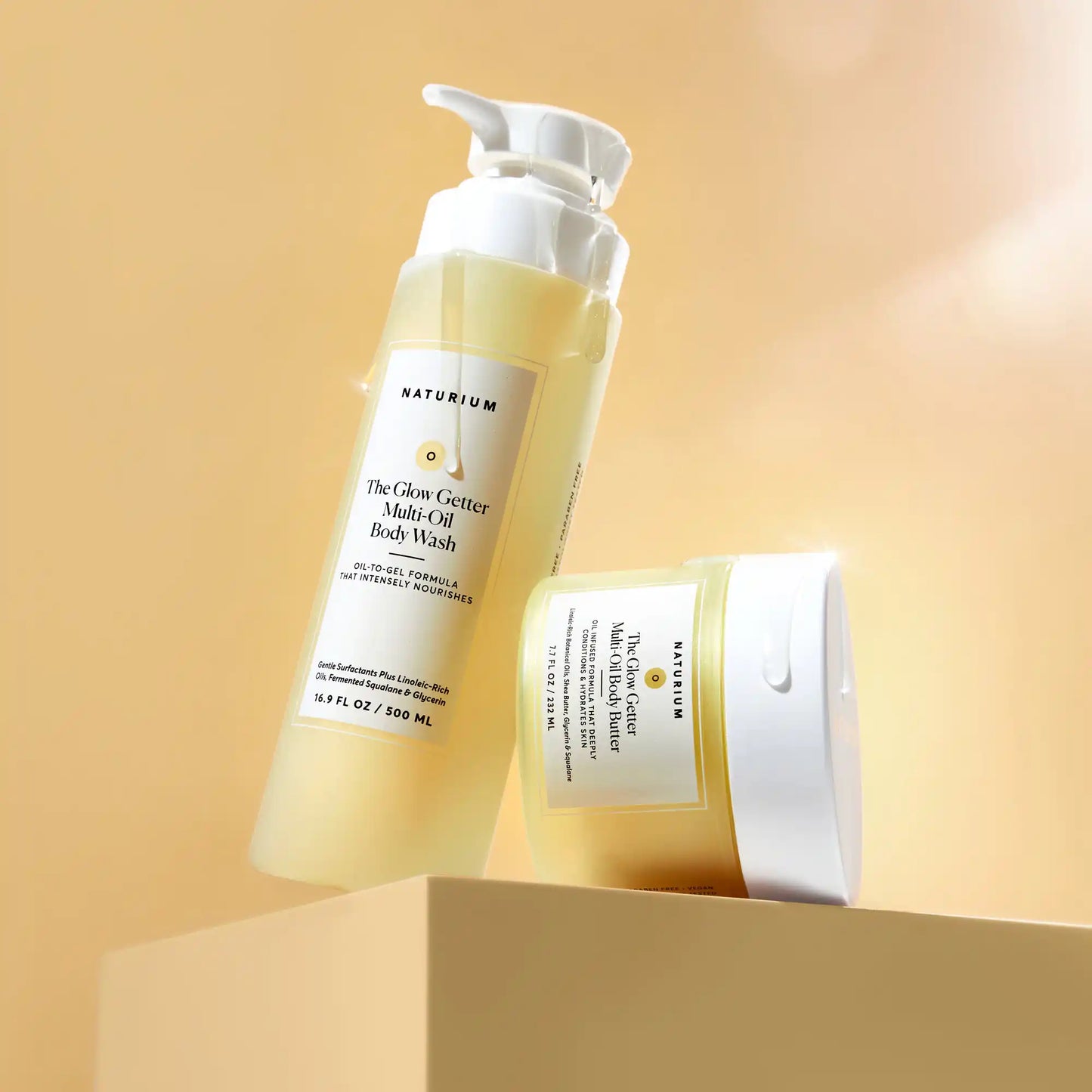 the-glow-all-out-body-bundle-w2 gg-bodybutter_1464-crop_revcolor_FL.webp